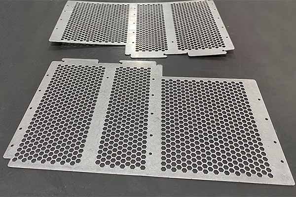 Sheet metal panels being laser cut by advanced precision machine