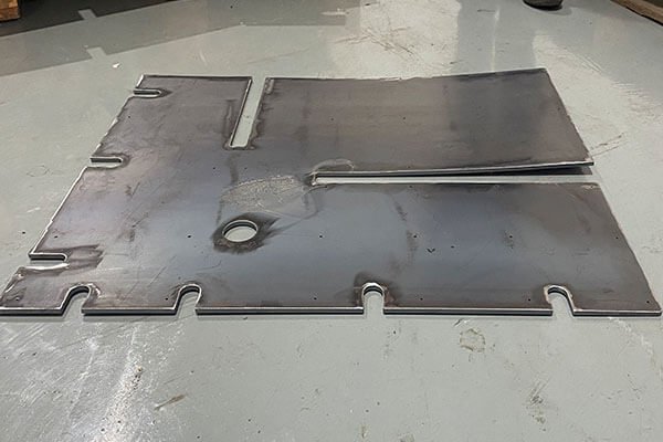 Large laser-cut parts (before and after leveling)